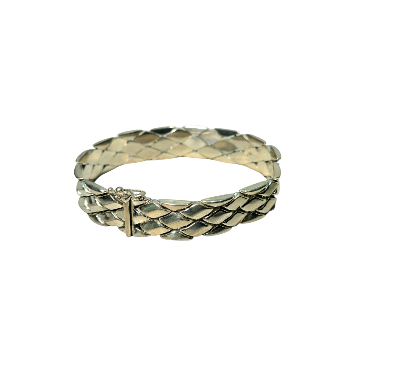 Semi-rigid bracelet with embossed diamond pattern in hallmarked silver.