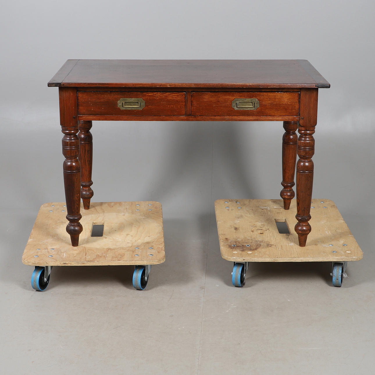 A STAINED PINE SIDE TABLE.