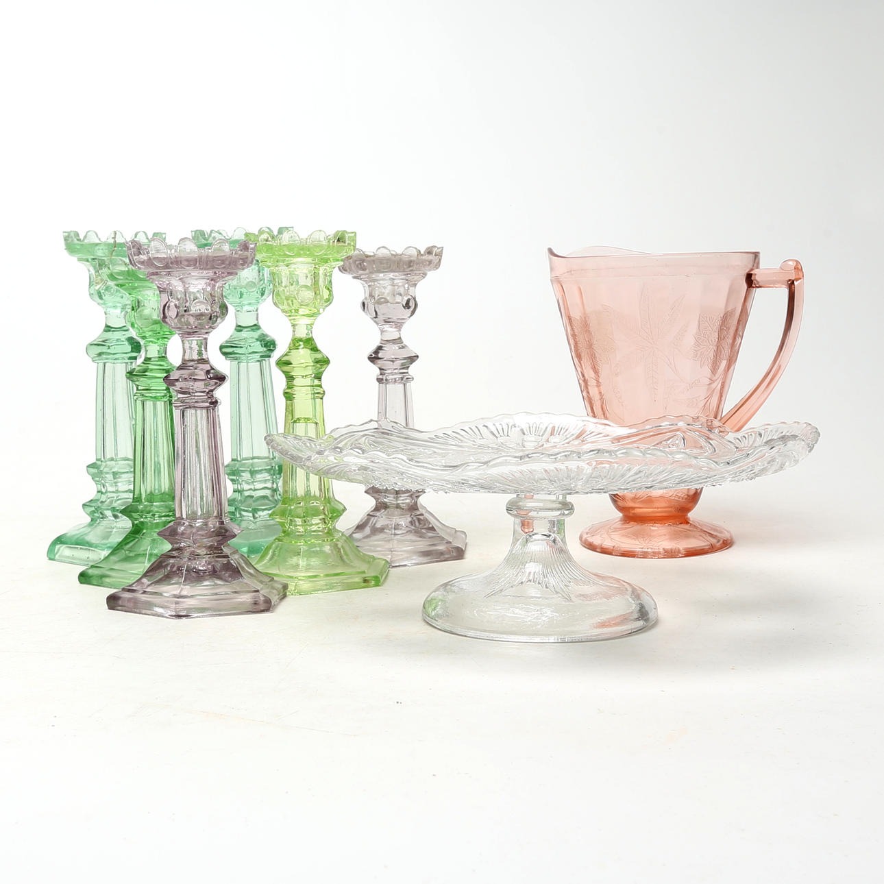 PRESSED GLASS PIECES, 8 pcs, mostly candlesticks, including uranium glass.