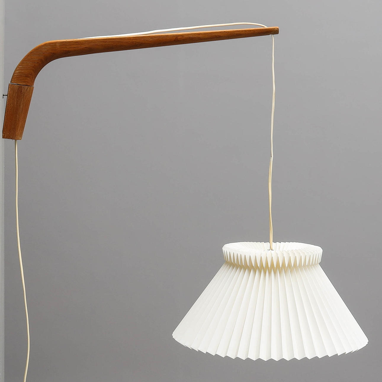 WALL LAMP, with adjustable arm, oak, shade Le Klint, Denmark.