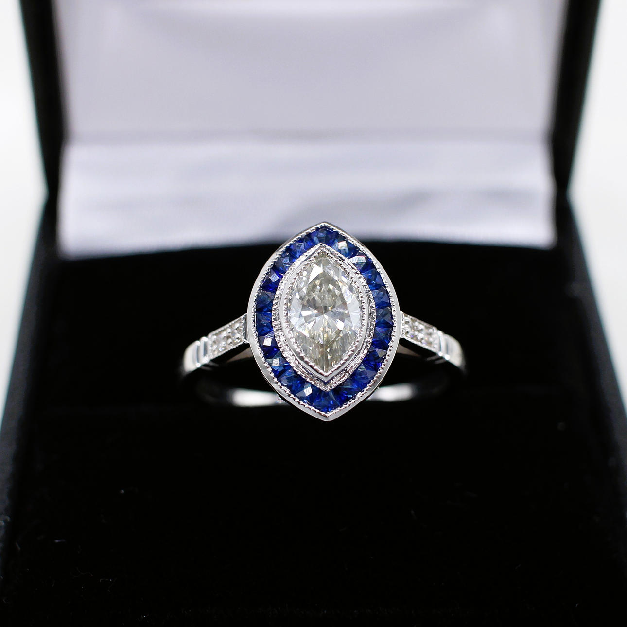 MARQUISE SHAPED DIAMOND & SAPPHIRE RING.