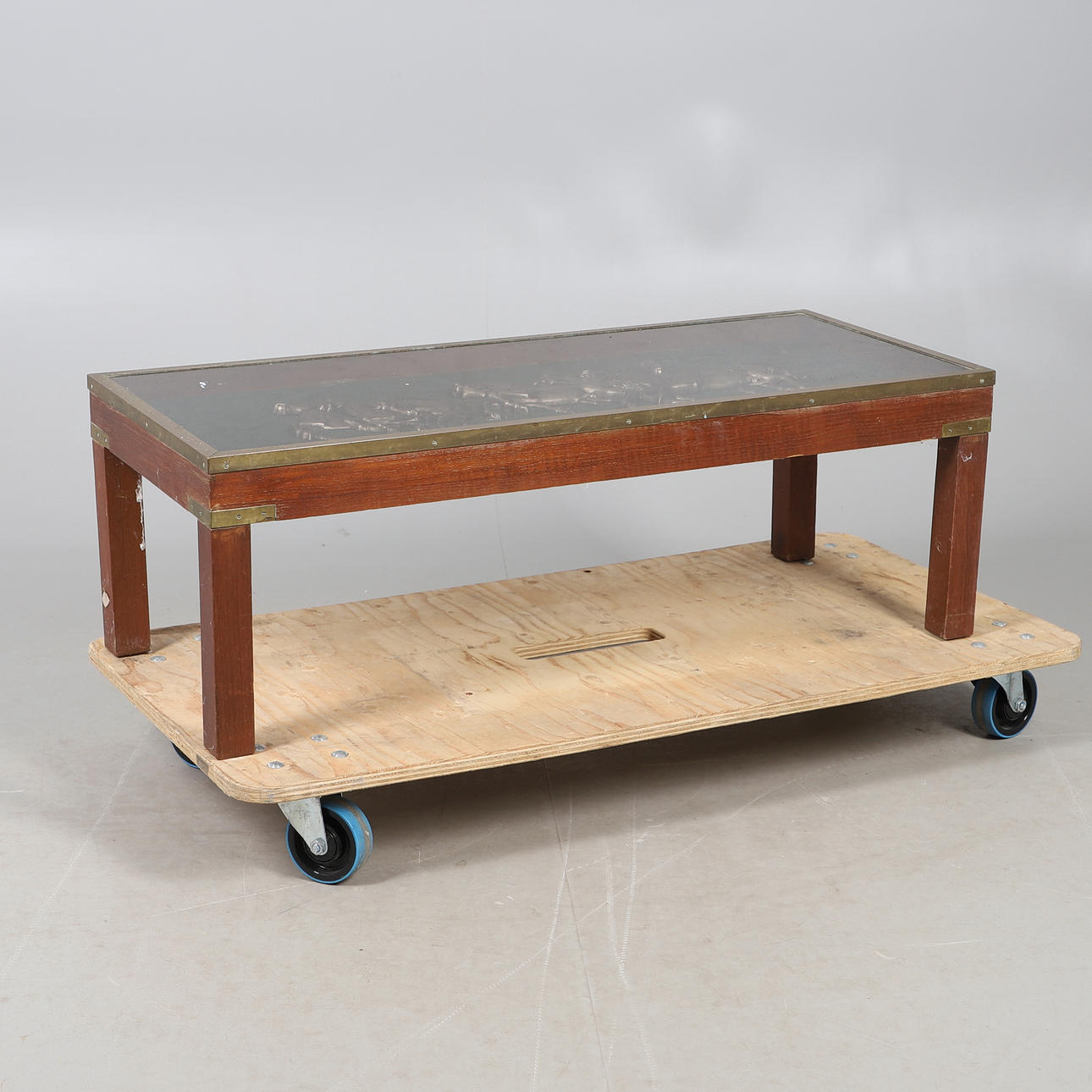 A BRASS EDGED COFFEE TABLE.