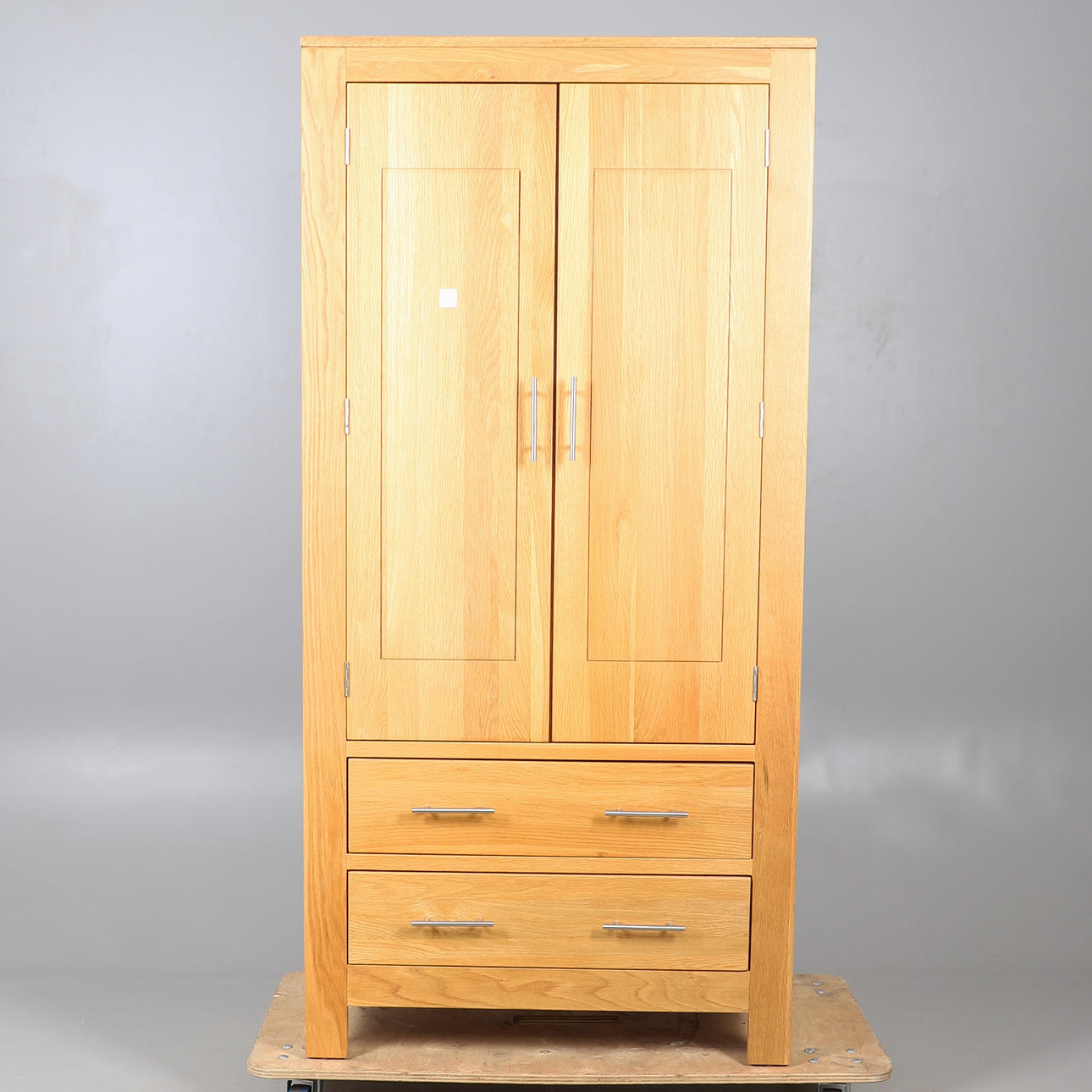 A MODERN OAK WARDROBE.