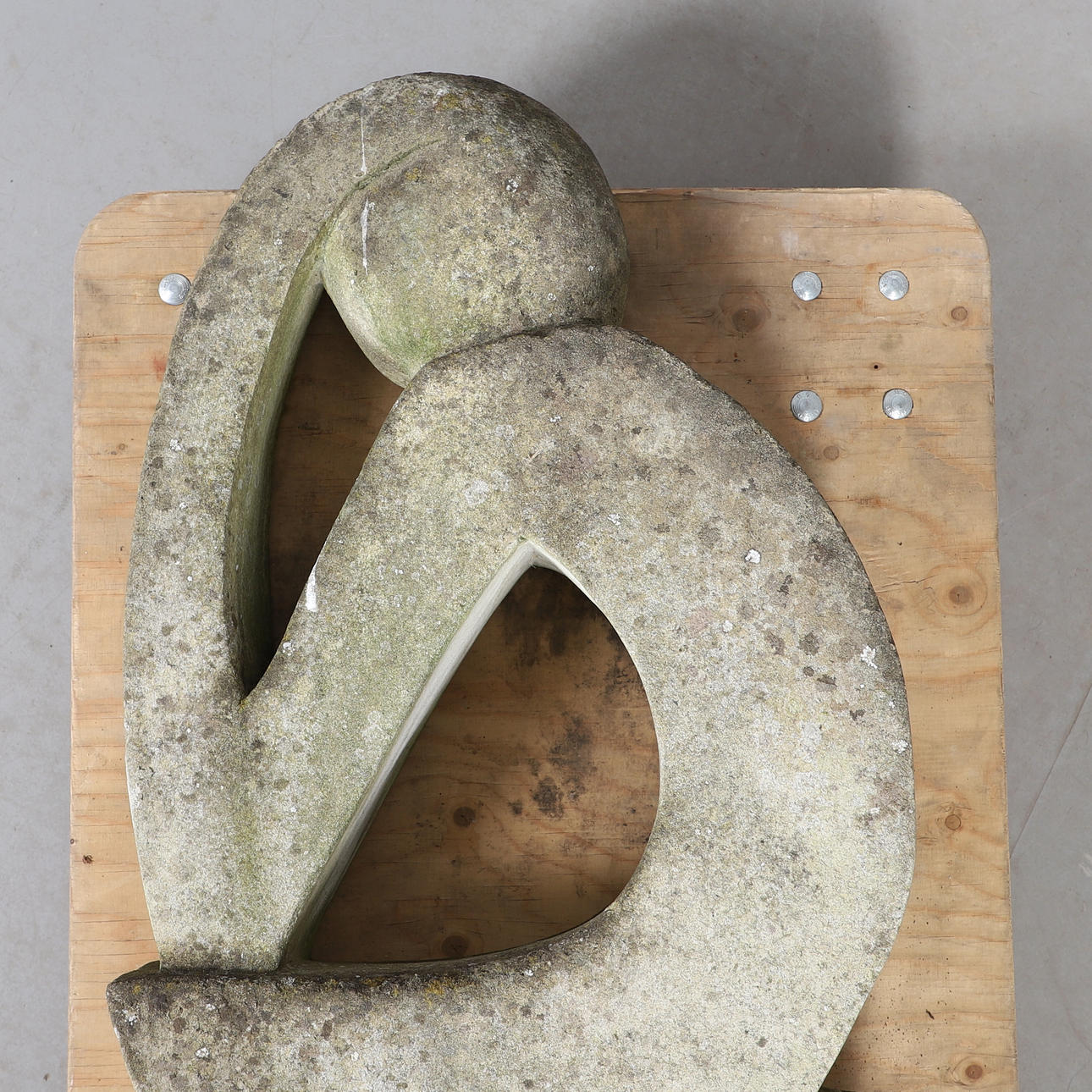 A LARGE CONCRETE GARDEN STATUE.