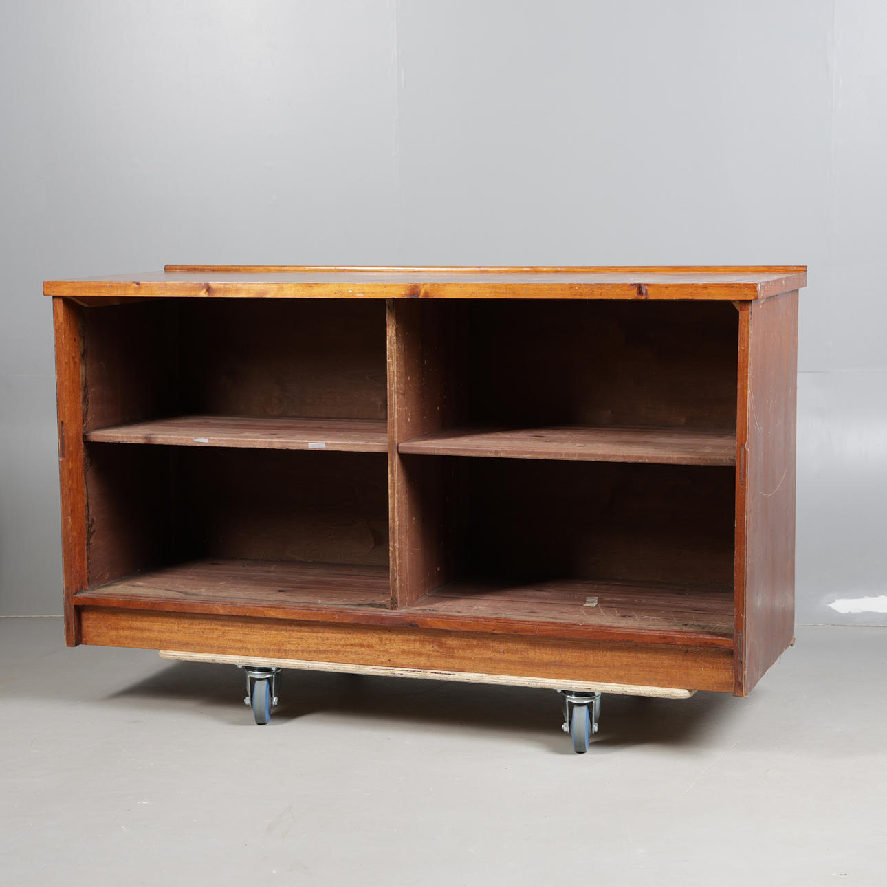 A WOODEN SHOP COUNTER.