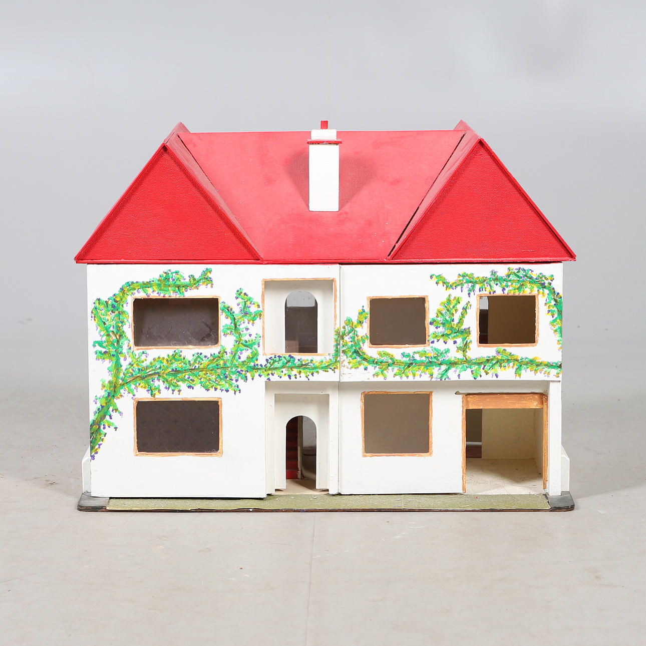 A VINTAGE SCRATCH BUILT DOLLS HOUSE.