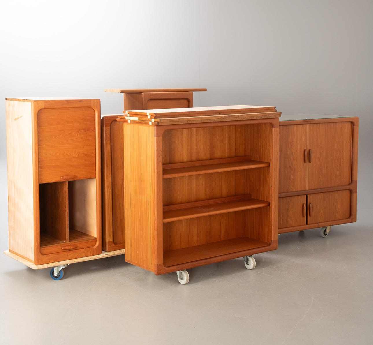 Large shelving system in teak by Dyrlund.