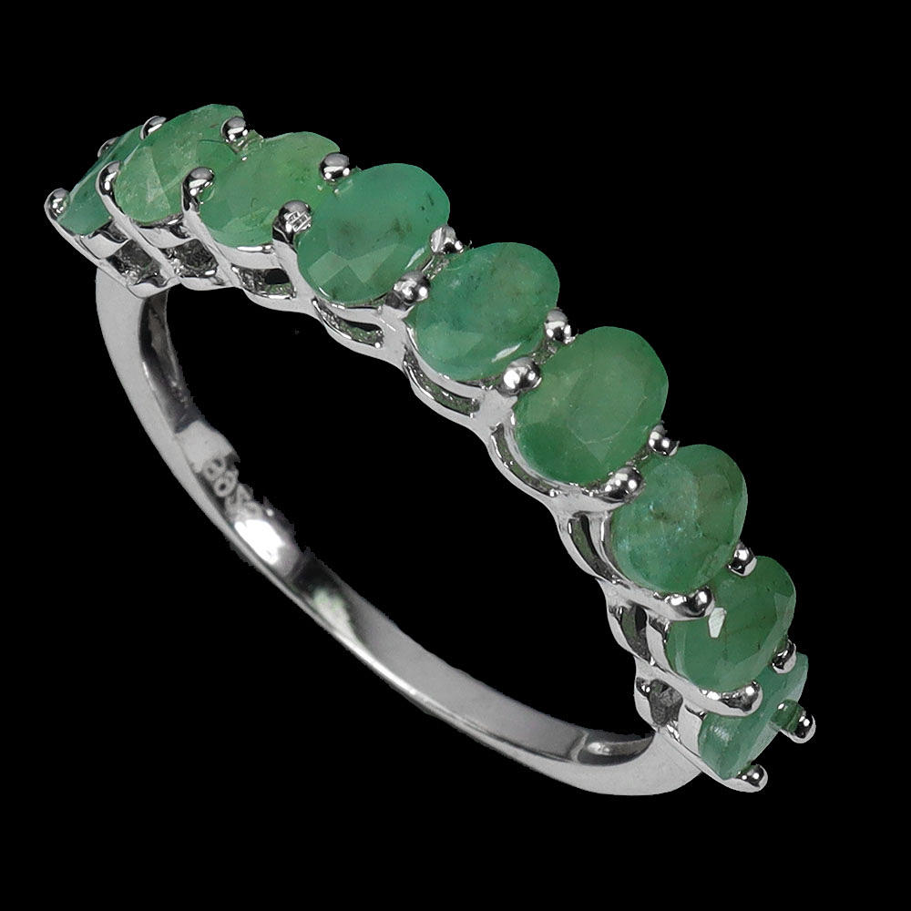 SILVER EMERALD HALF ETERNITY RING.