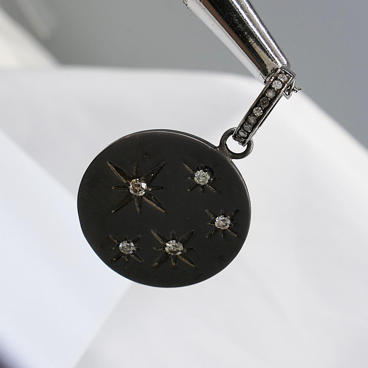 DIAMOND-SET disc pendant.