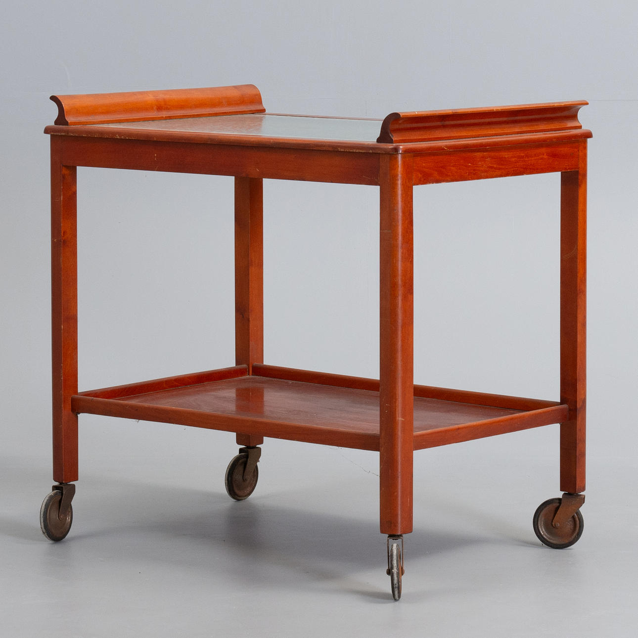 SERVING TROLLEY in beech with glass, 1950s.