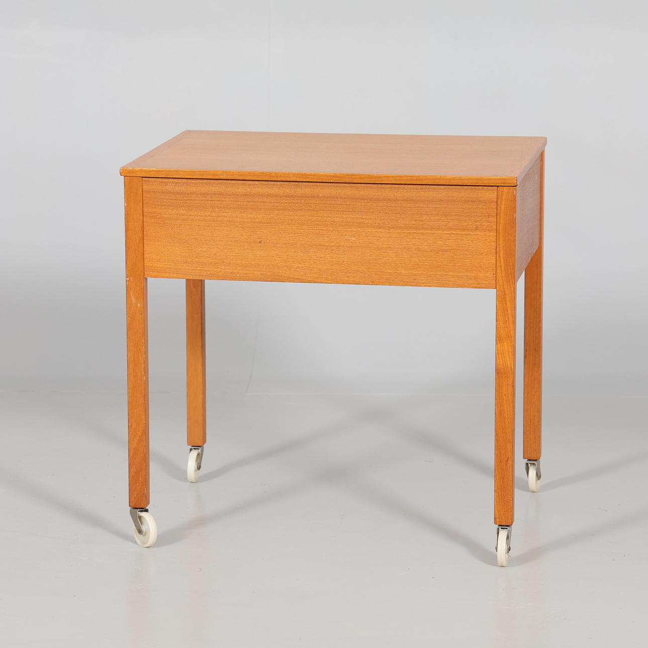 SEWING TABLE on casters, oak, mid-20th century.