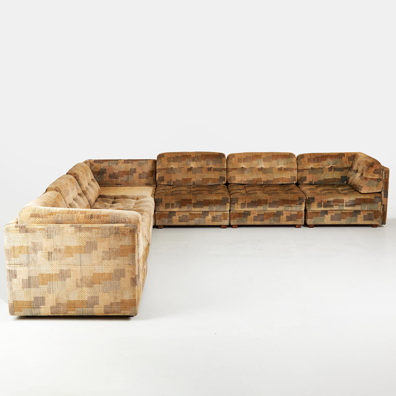 SOFA, 7 modules, including one side table, 1970s, textile upholstery, loose back cushions.