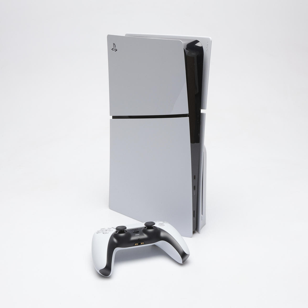 PLAYSTATION 5, with controller and cables.