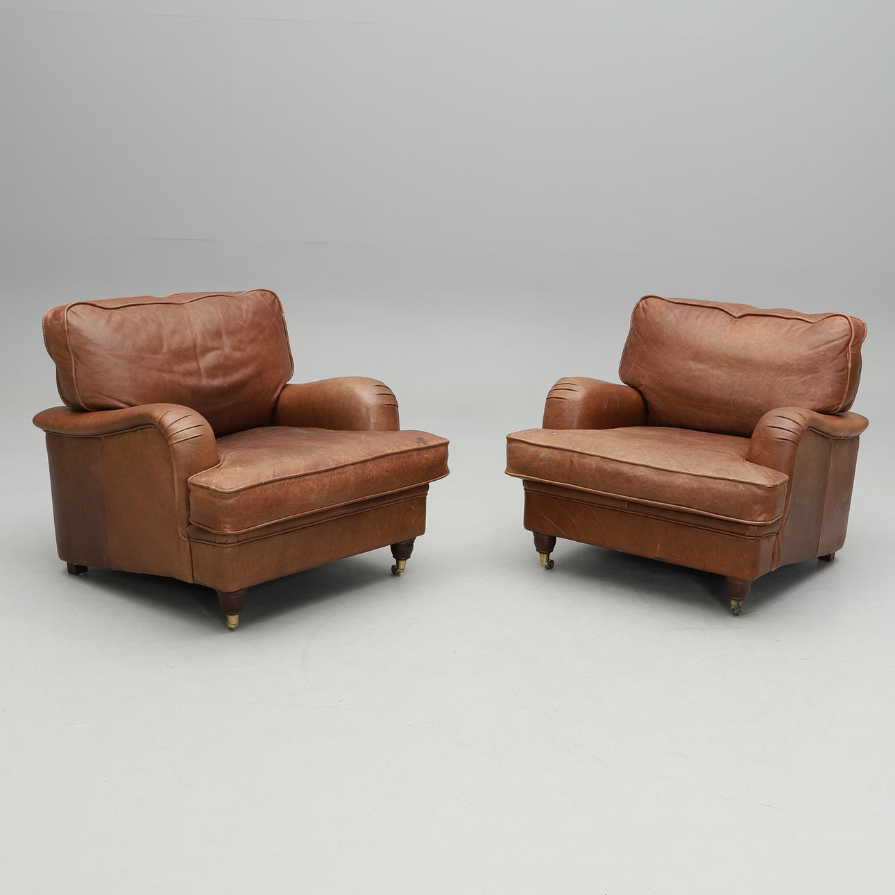 ARMCHAIRS, a pair, Howard model.