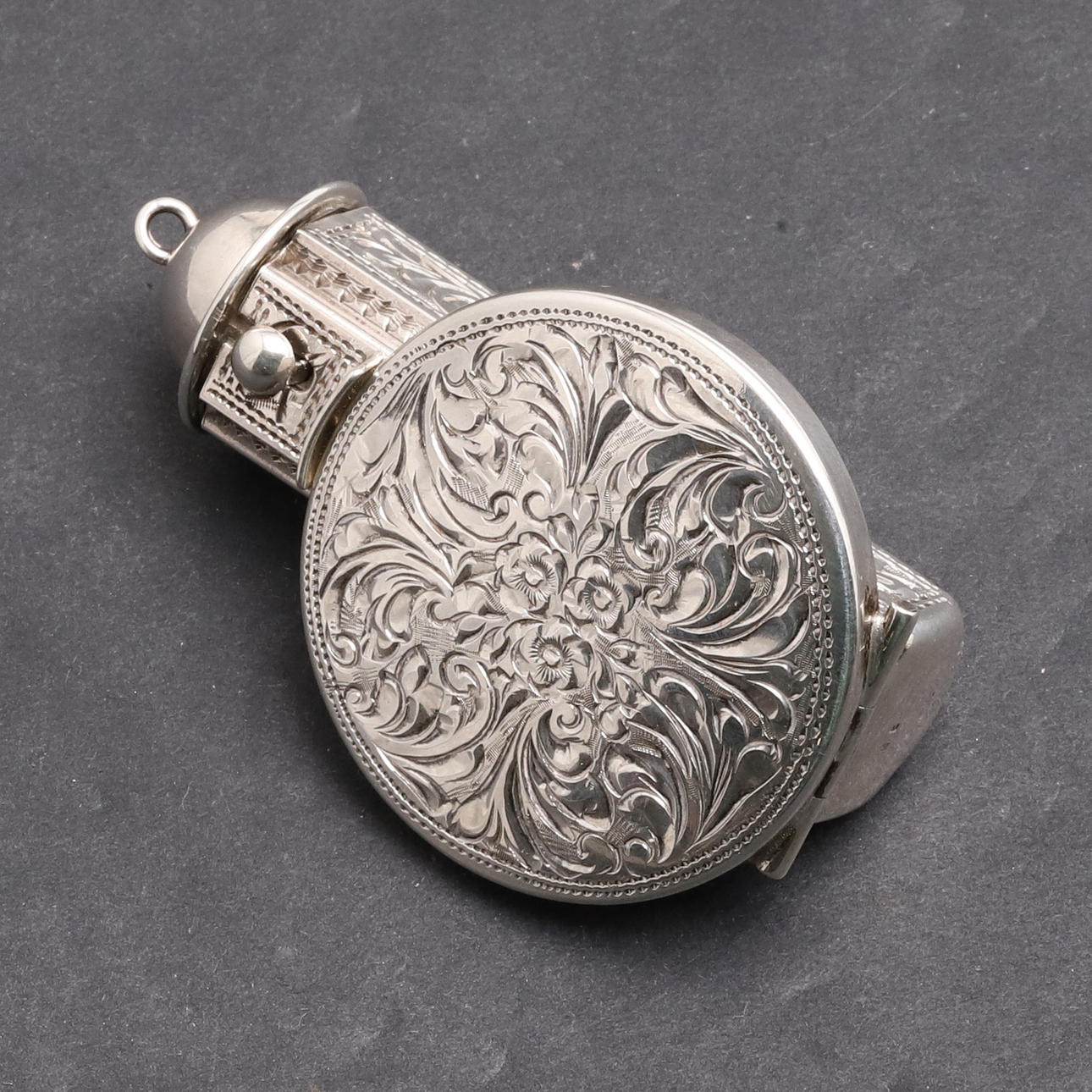 A STERLING SILVER LIPSTICK HOLDER.