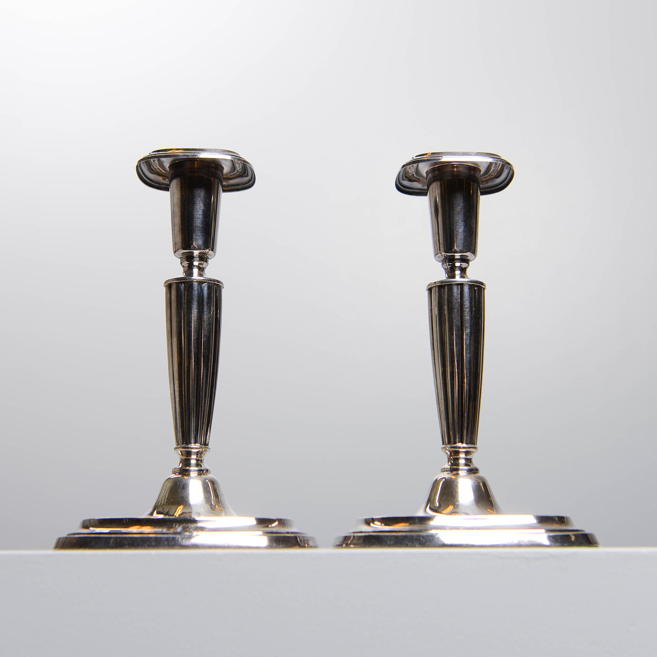 CANDLESTICKS, a pair, silver, Hallbergs, Stockholm, 1956.