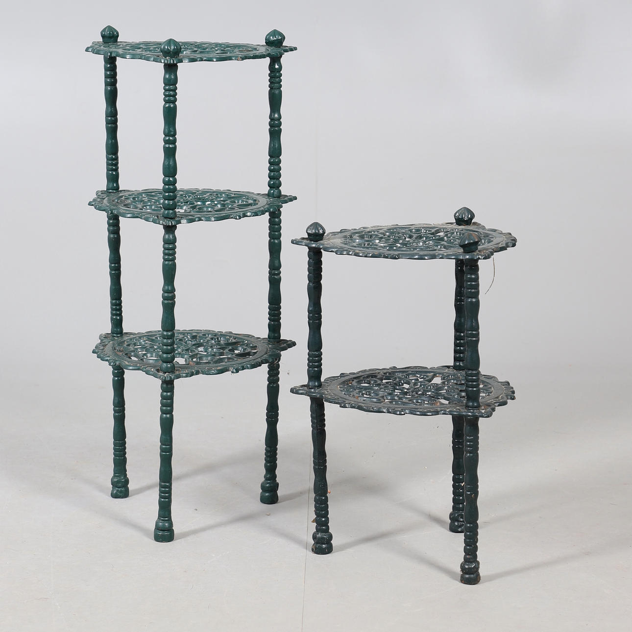 TWO PIERCED PAN STANDS.