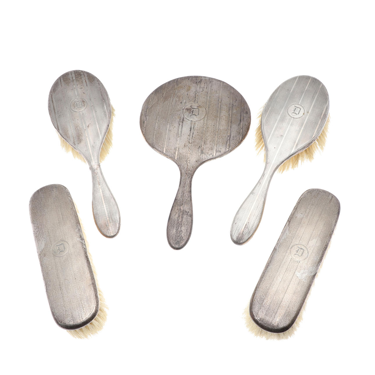 A GEORGE V SILVER BACKED DRESSING TABLE SET.