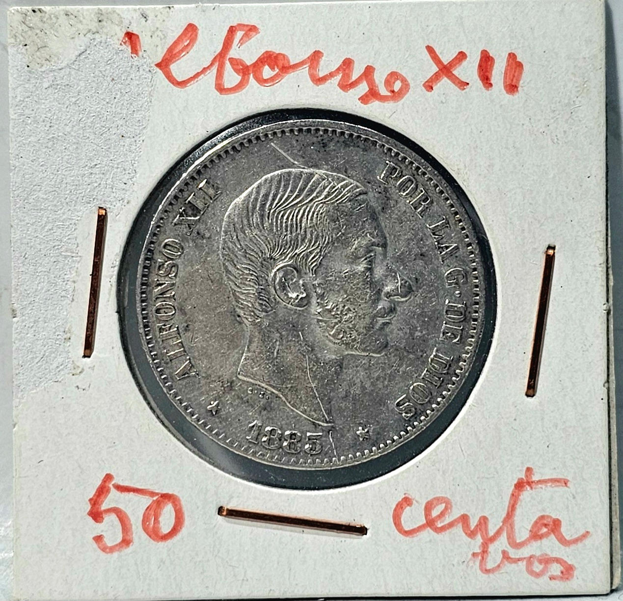 A 50 centavos silver coin. Year 1885.