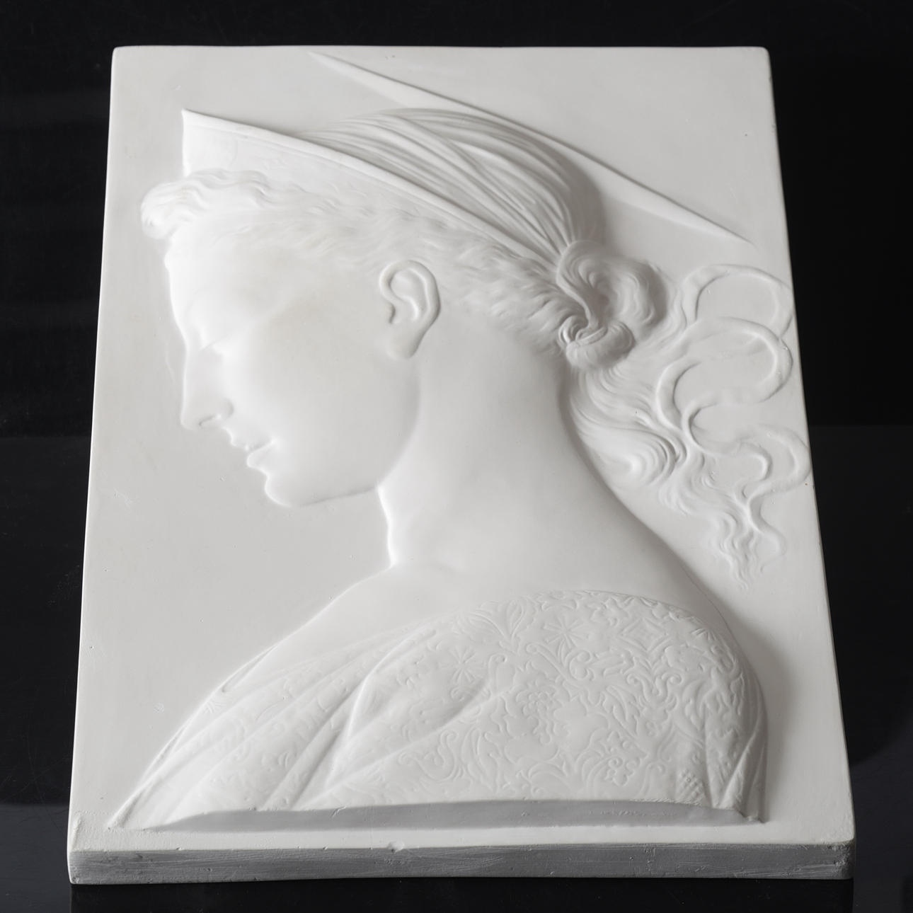 WALL PLAQUE, plaster, 20th century.