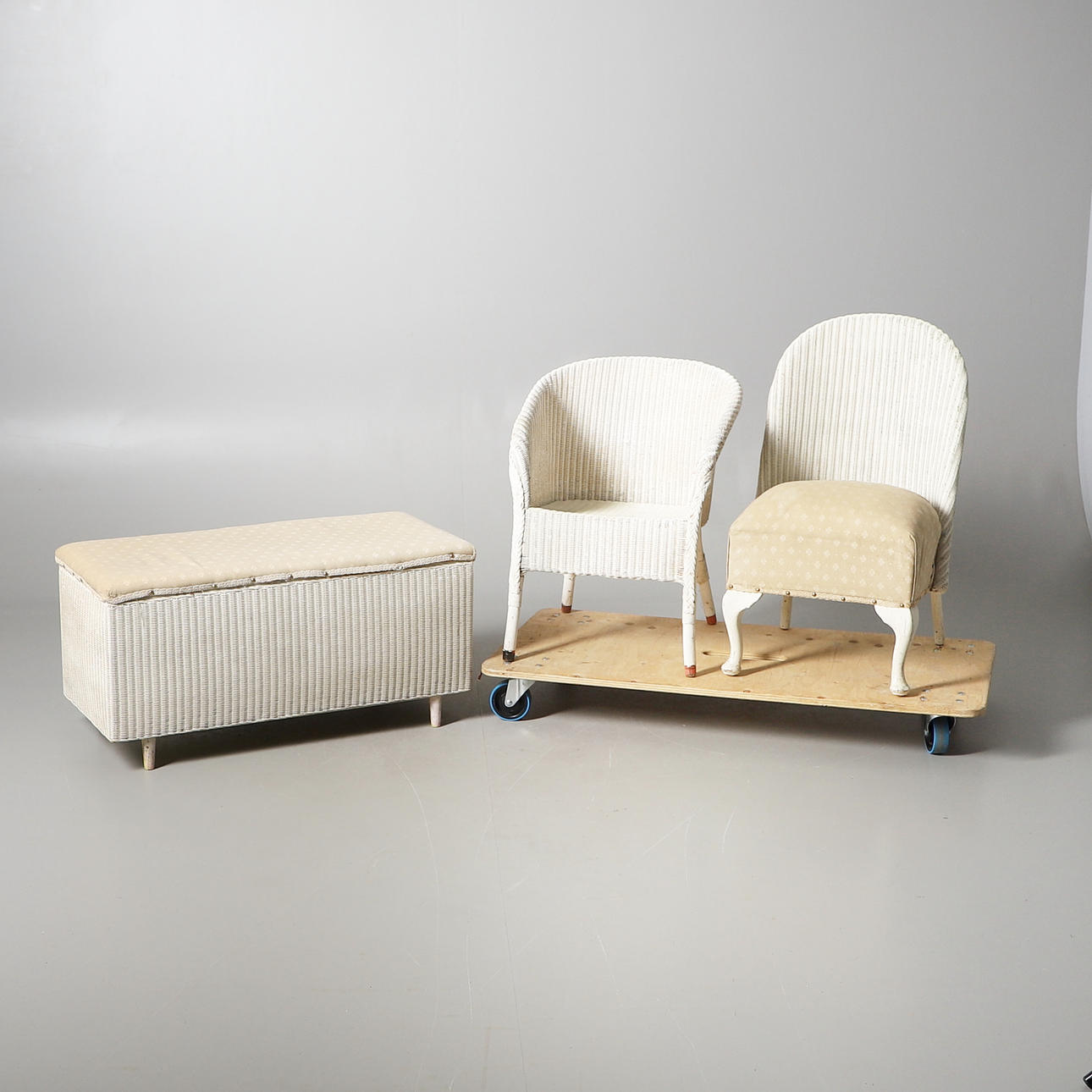 TWO LLOYD LOOM TYPE CHAIRS AND OTTOMAN.