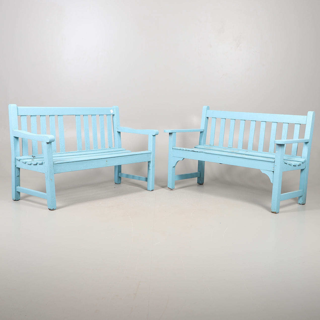 TWO WOODEN GARDEN BENCHES.