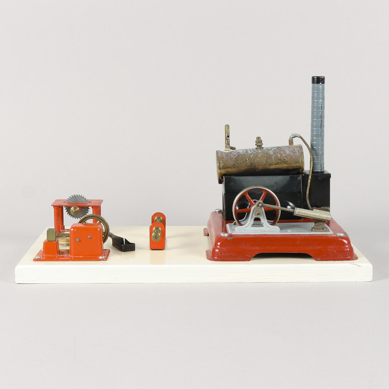 STEAM ENGINE mounted on a wooden base.
