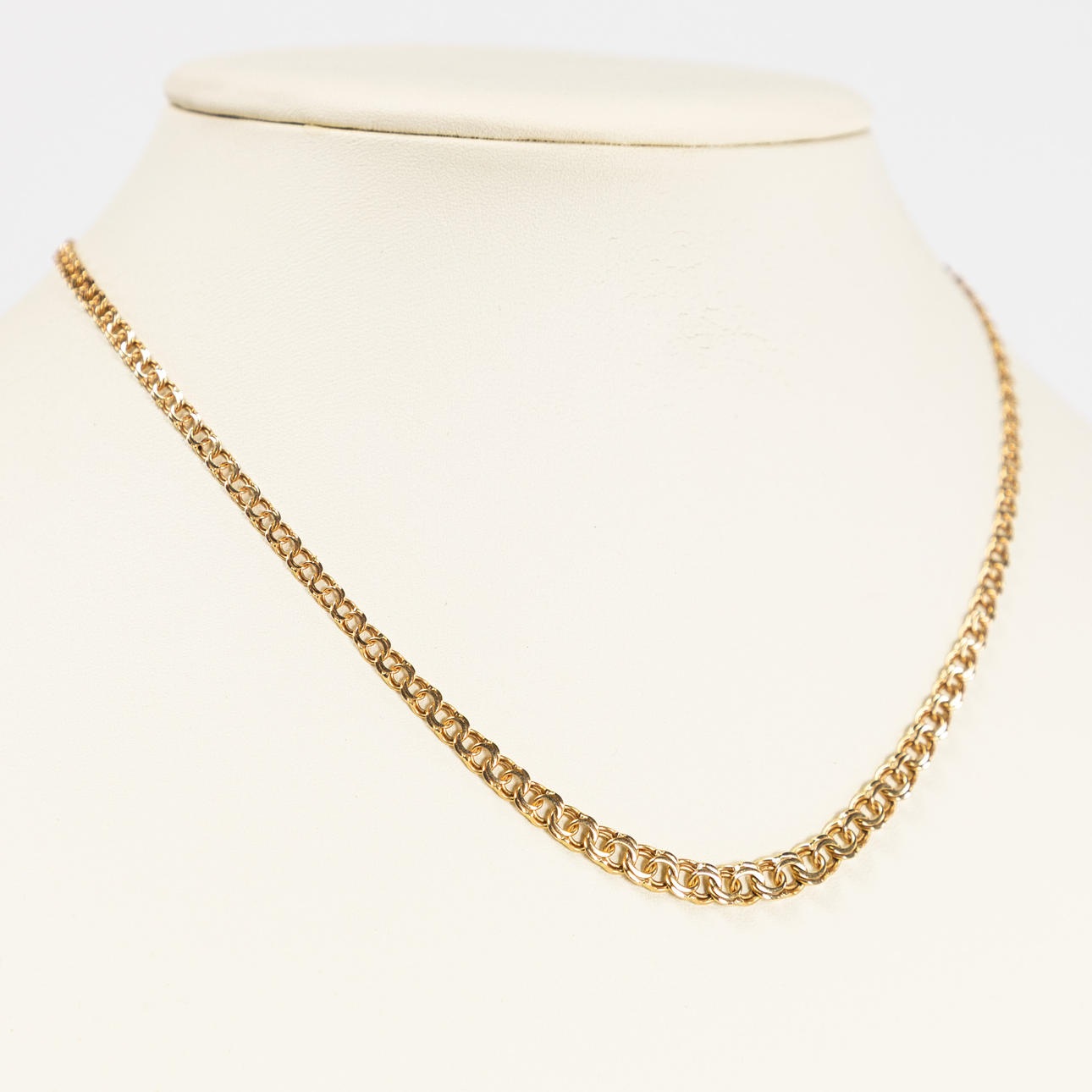 BISMARCKLÄNK. 18k guld, GHA.