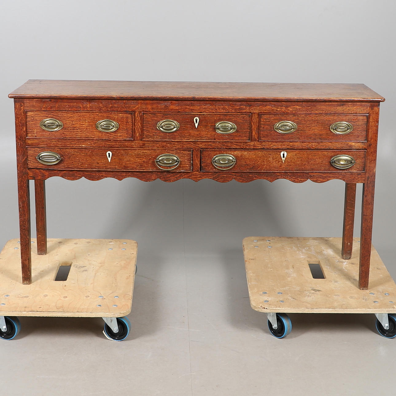 A GEORGIAN OAK DRESSER.