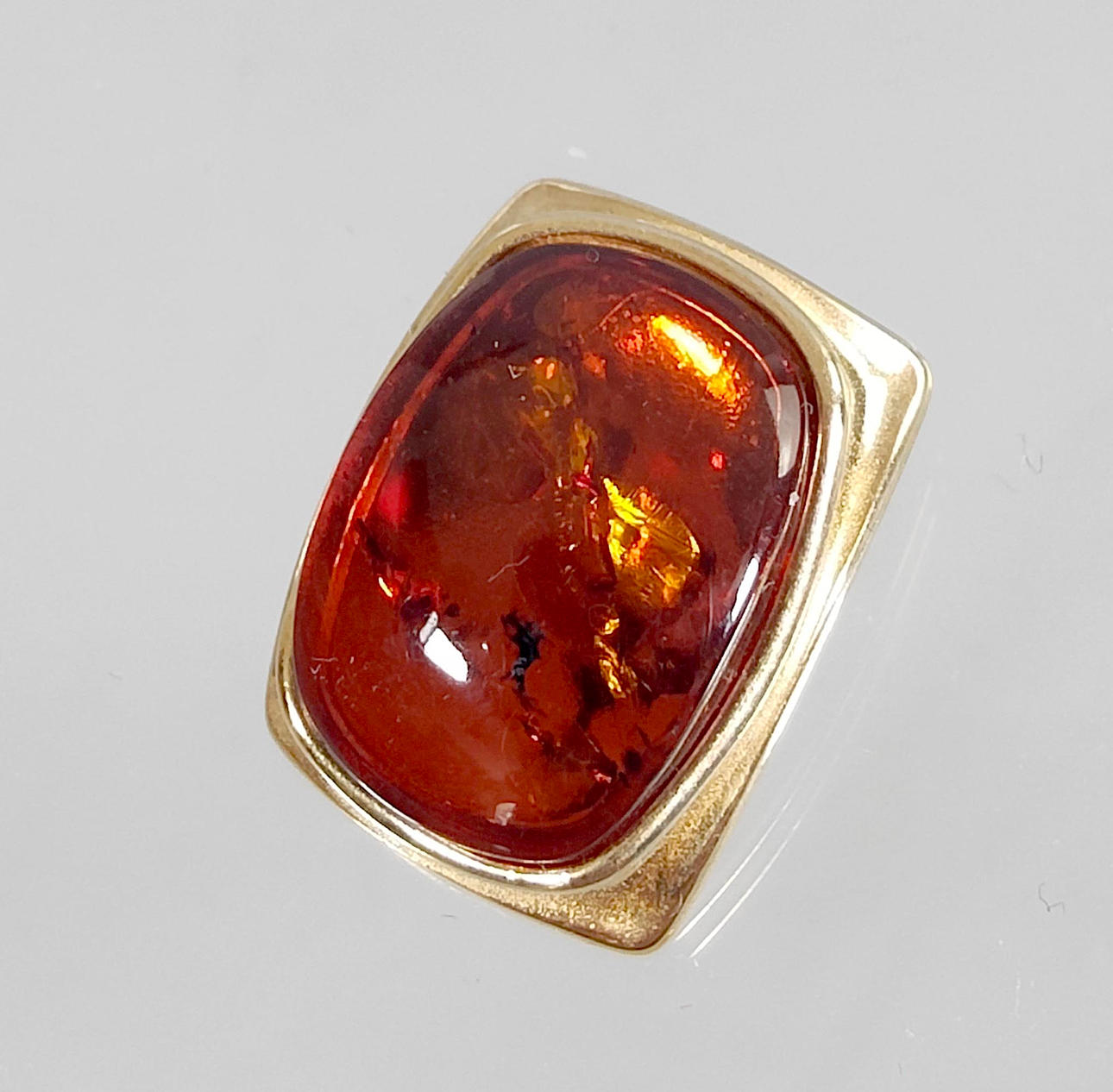 Modern amber pendant, 925 silver, gilt.