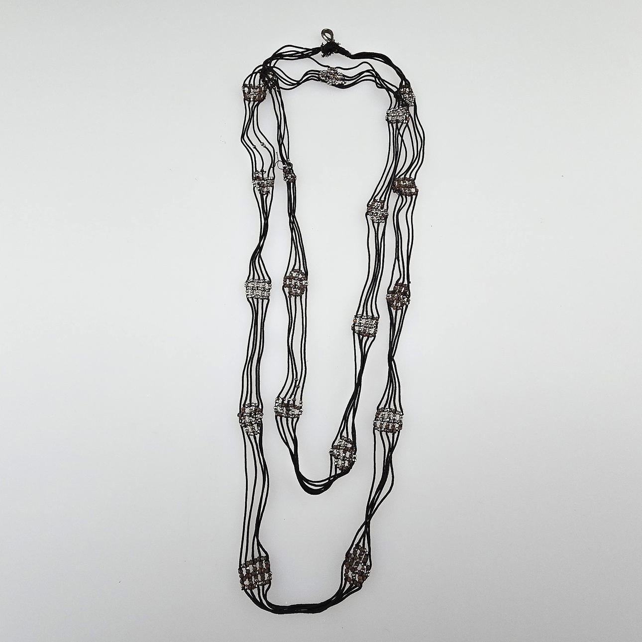 LONG WATCH CHAIN WITH IRON ORNAMENTS.
