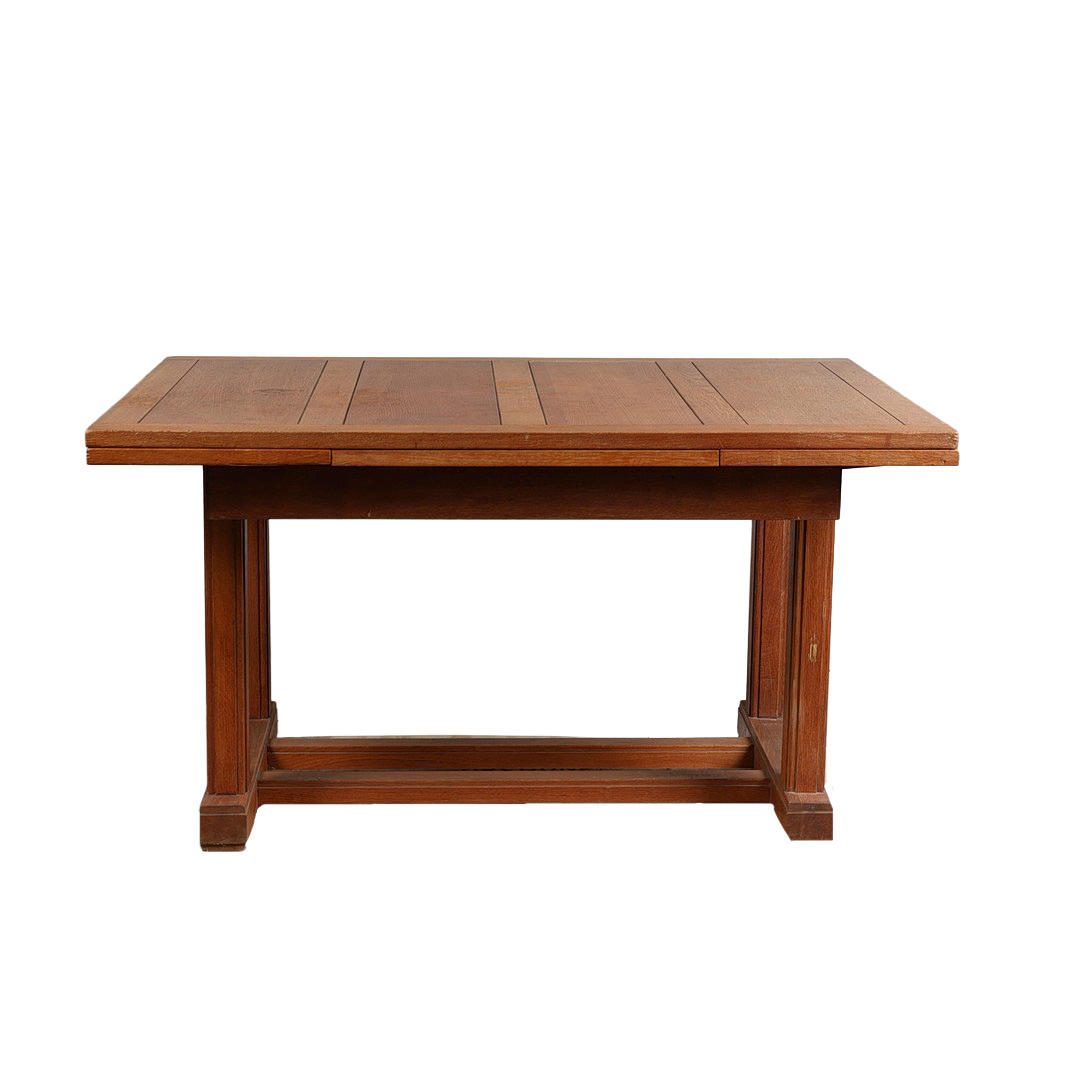 A GORDON RUSSELL OAK DRAW-LEAF DINING TABLE.