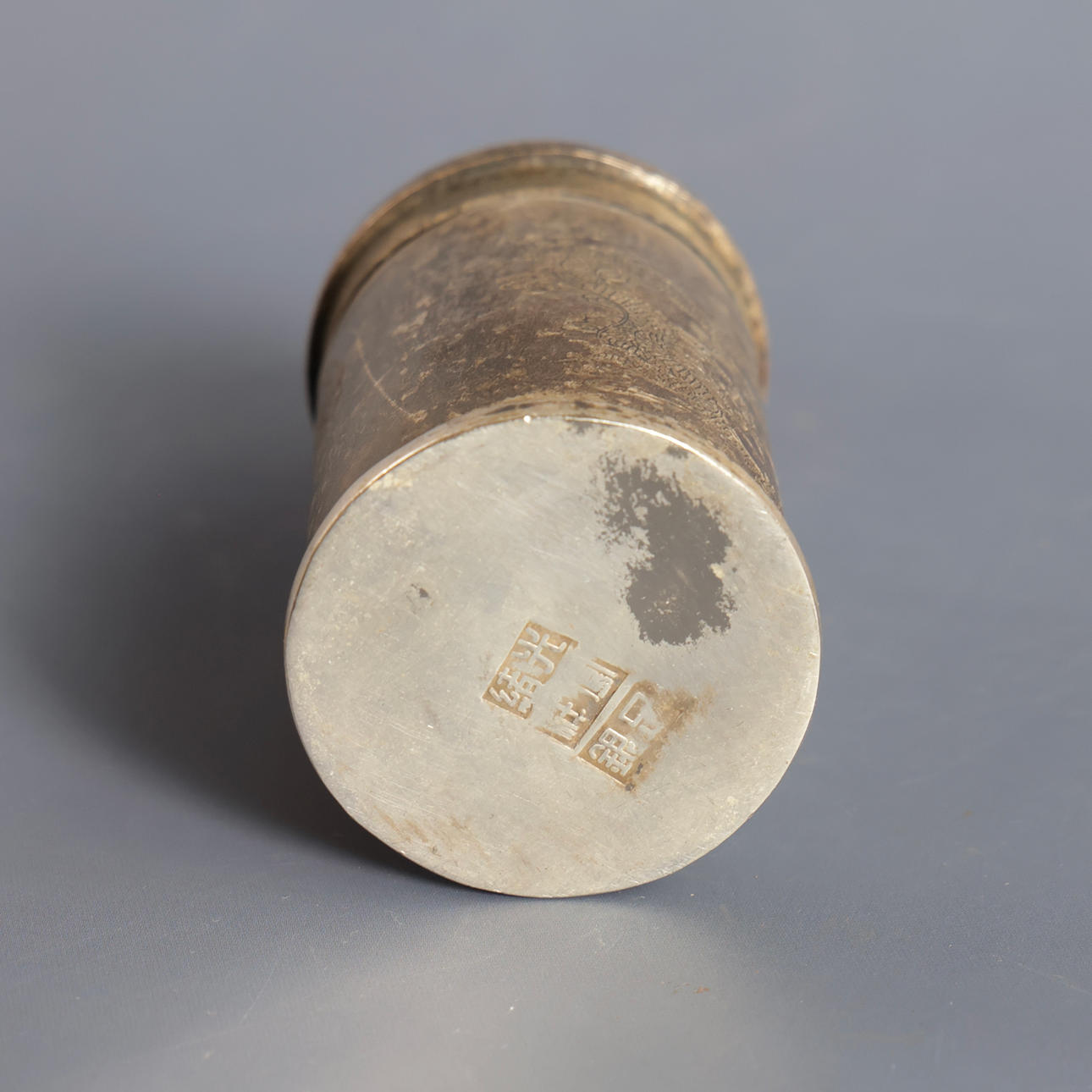 Two Chinese containers, decorated with characters and one with ...