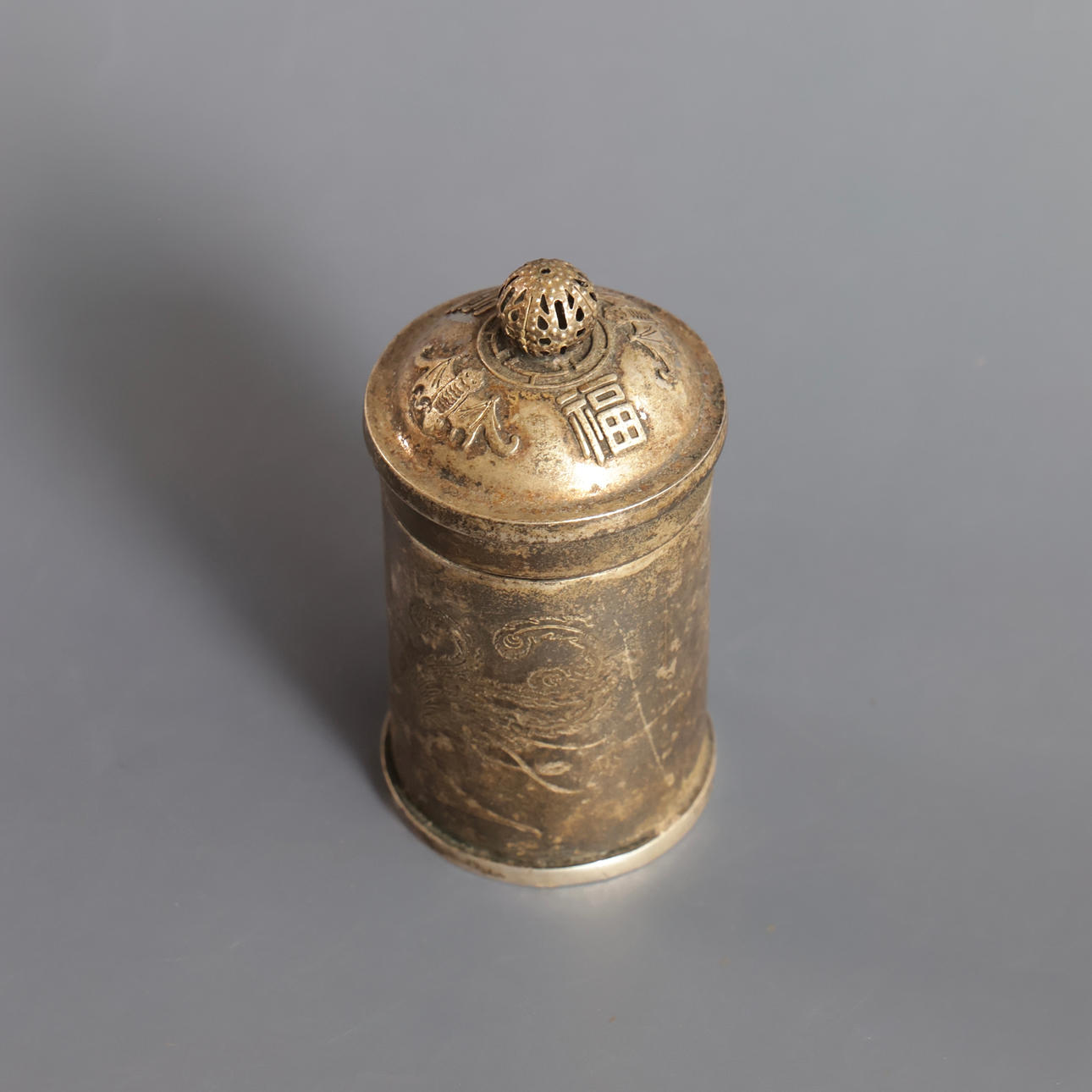 Two Chinese containers, decorated with characters and one with ...