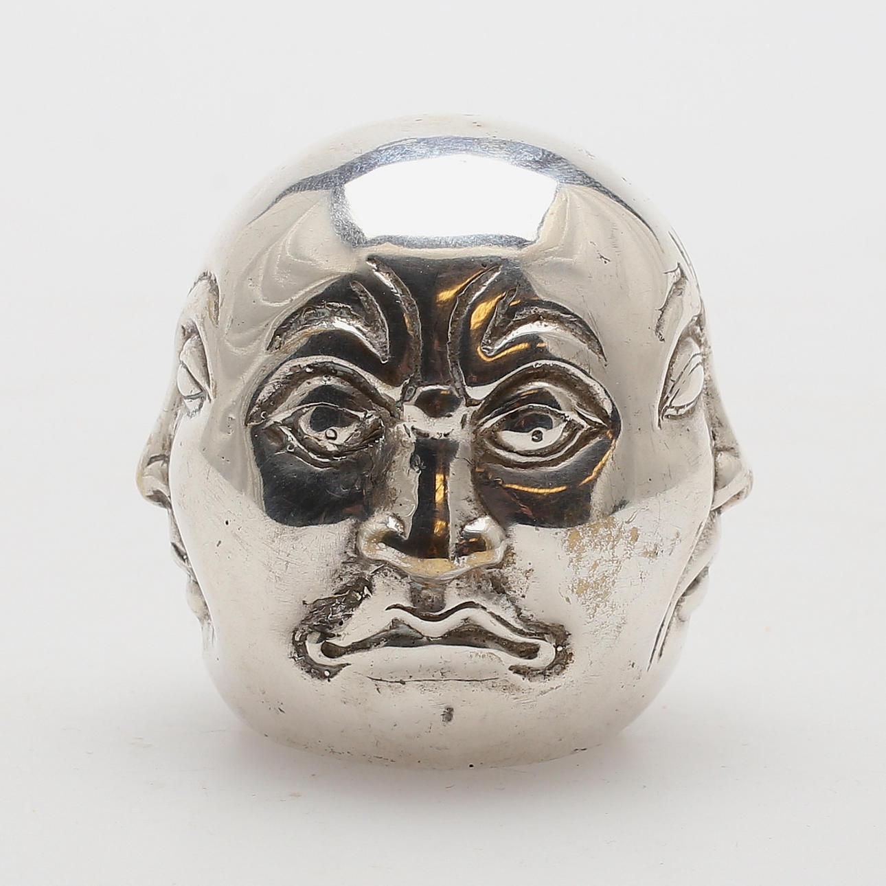 SKULPTUR, människans fyra ansikten, nysilver, Kina, sent 1900-tal/samtida.