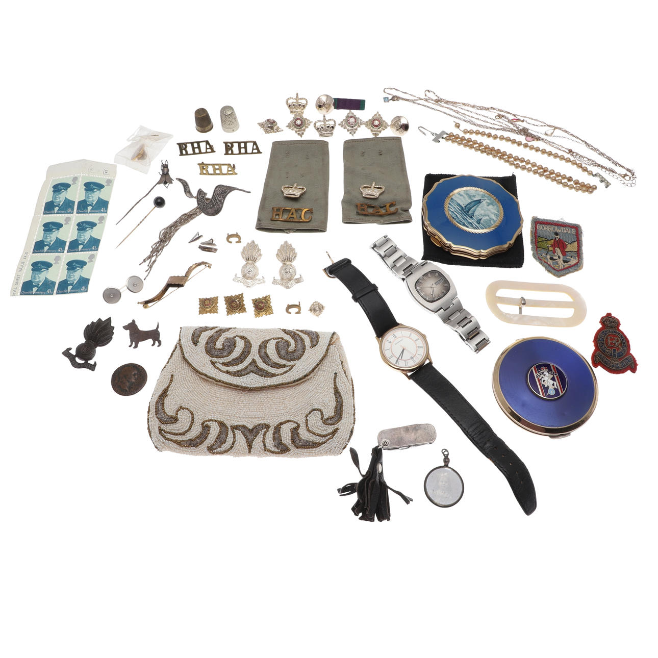 TWO STRATTON POWDER COMPACTS, A BEADED PURSE, MILITARY ITEMS ETC ...