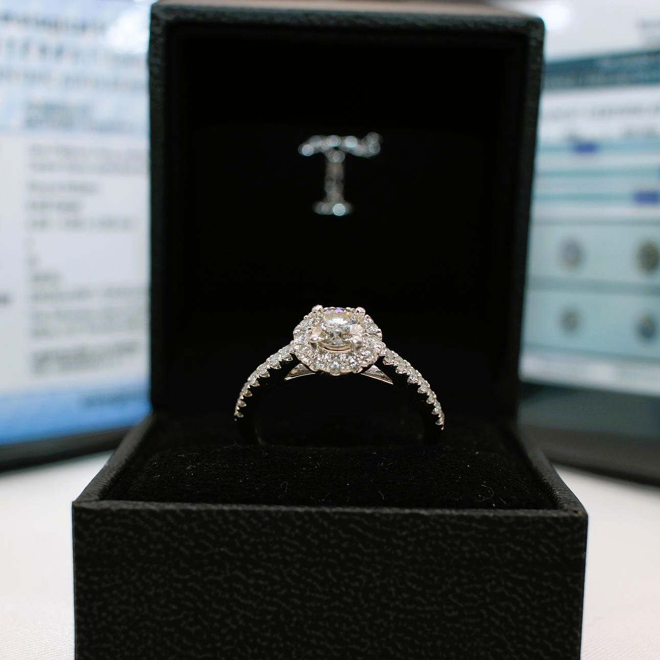TOLKOWSKY CERTIFIED DIAMOND RING.