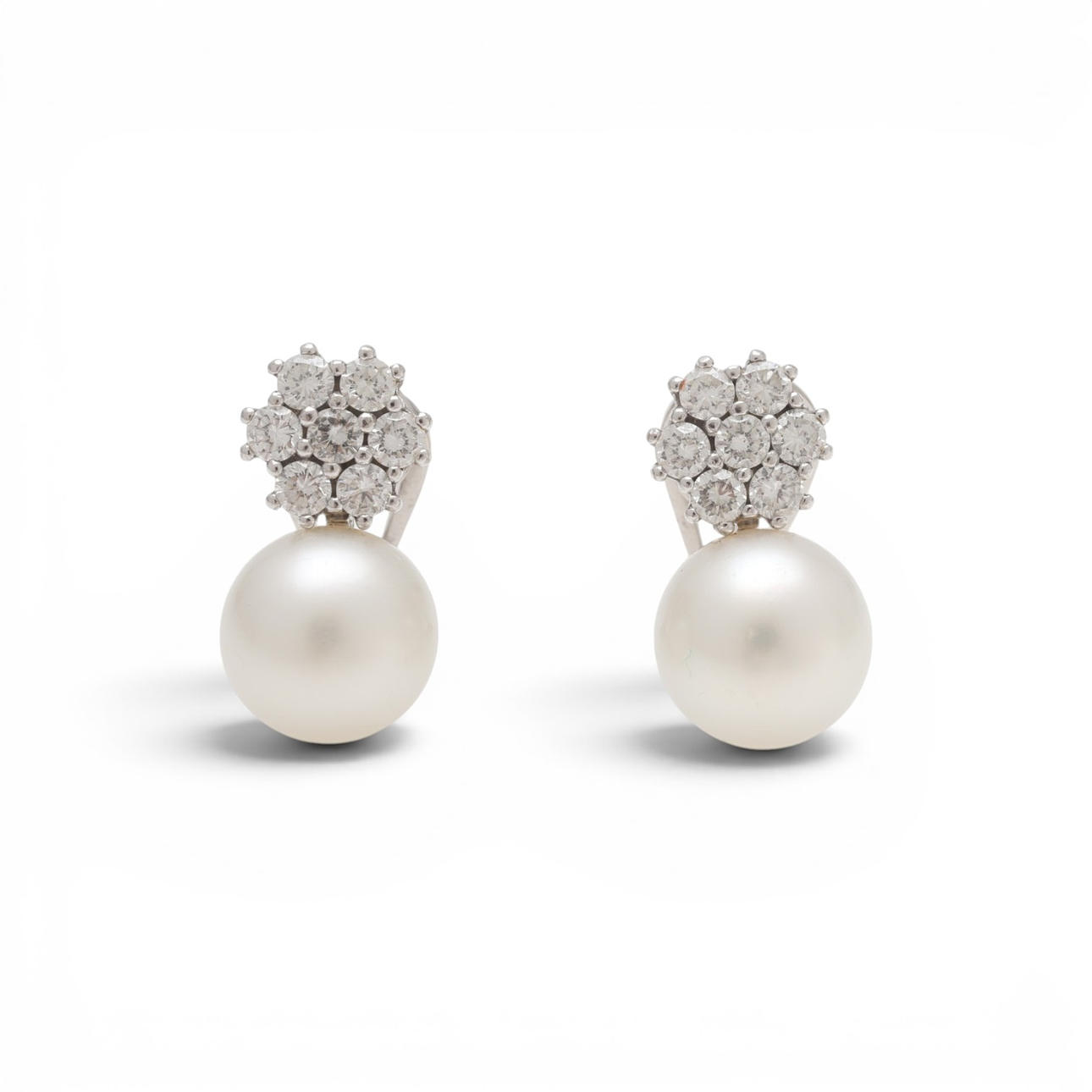 Pearl and diamonds rosette earrings.
