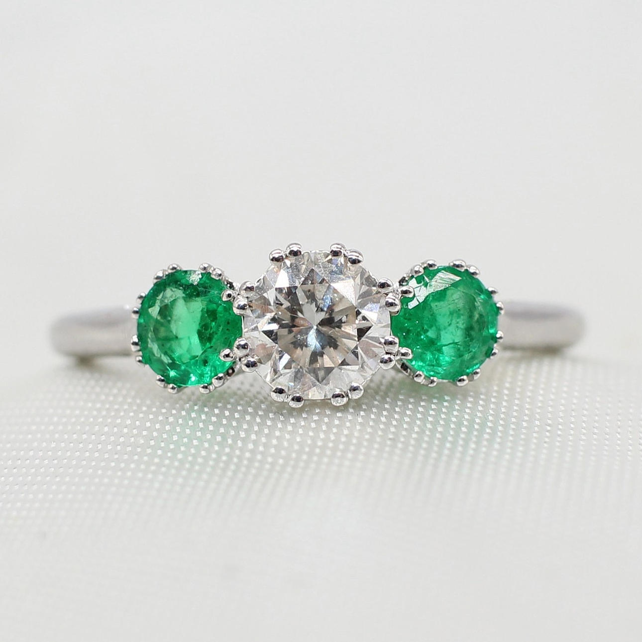 EMERALD & DIAMOND TRILOGY RING.