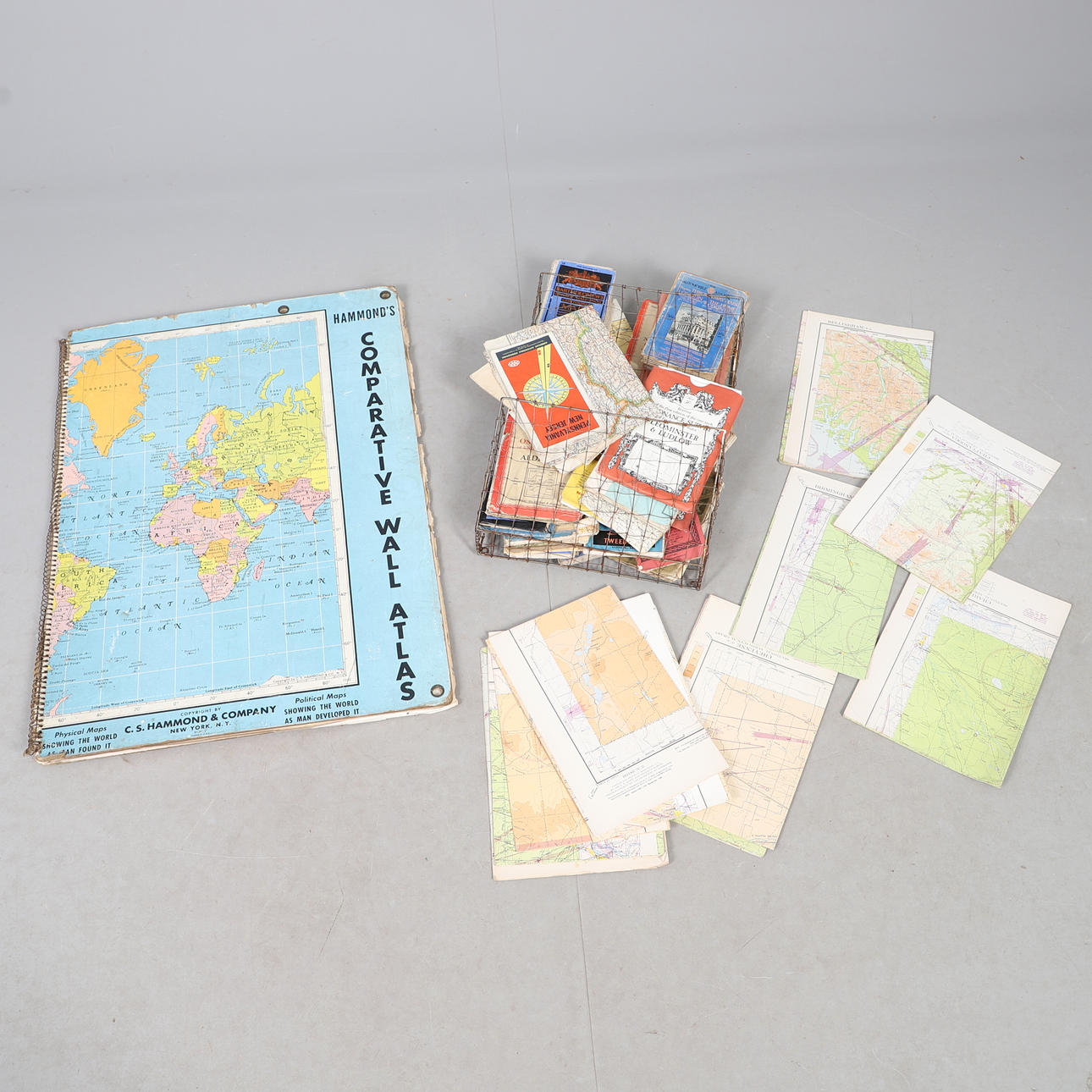 ASSORTMENT OF MAPS IN DISPLAY RACK. Books, Maps & Manuscripts - Maps ...