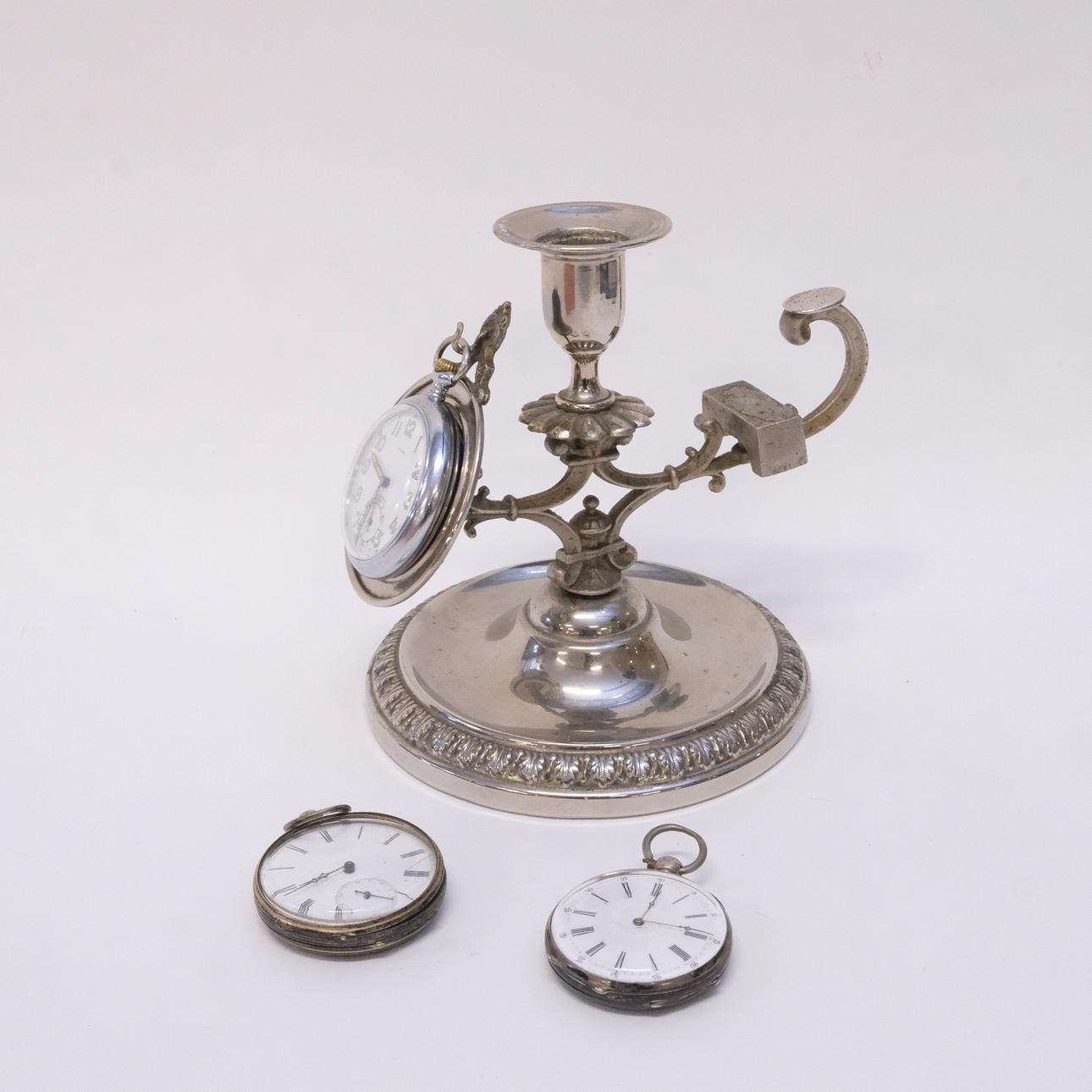 CANDLESTICK WITH POCKET WATCH STAND, AND 3 POCKET WATCHES. Lighting ...