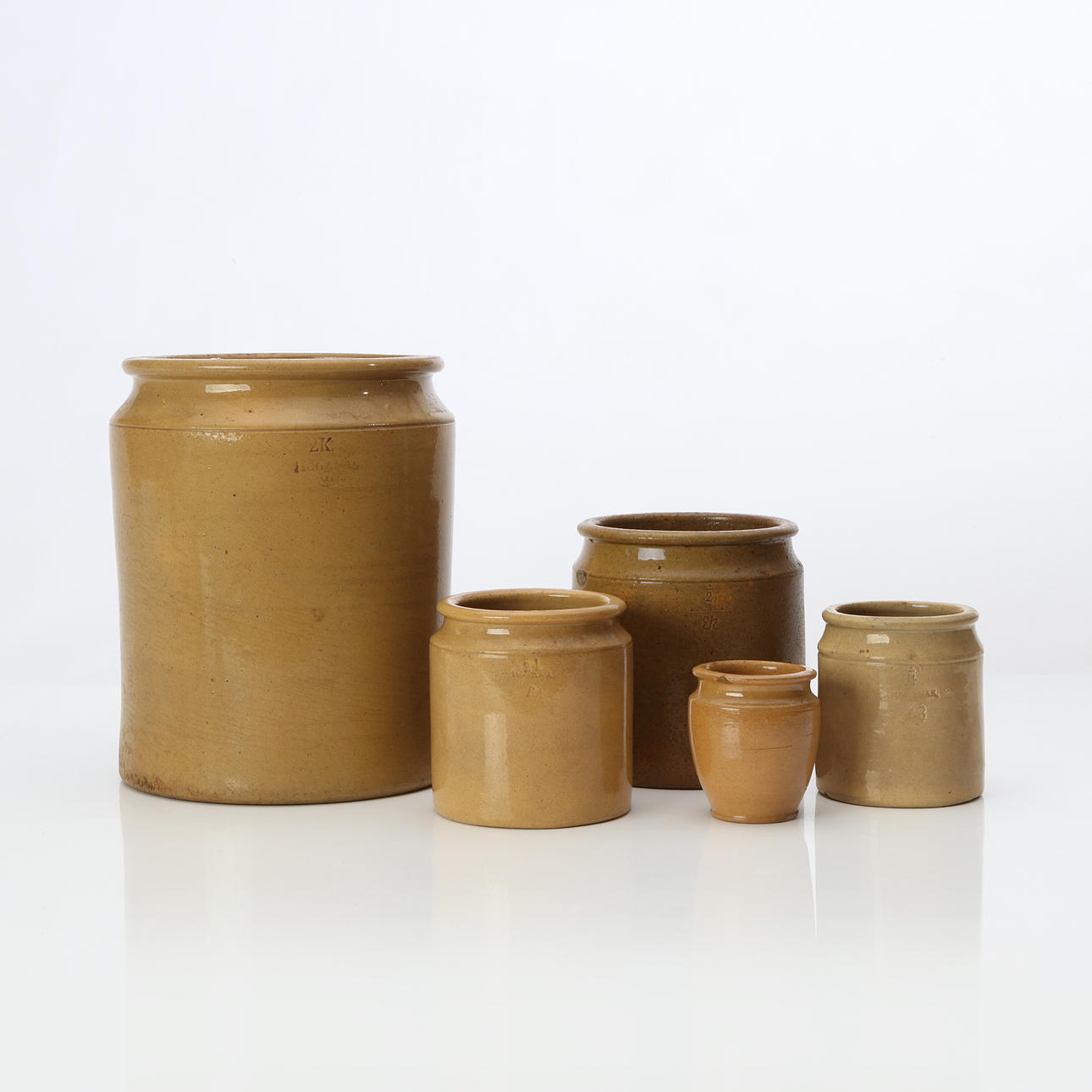 HÖGANÄS, JUGS, FIVE PCS. Glazed ceramic. 19th century.