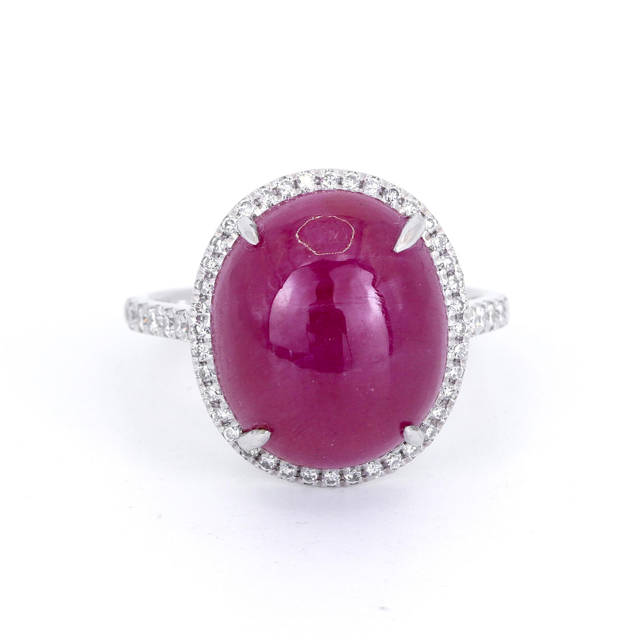 PLATINUM CABOCHON RUBY AND DIAMOND RING.