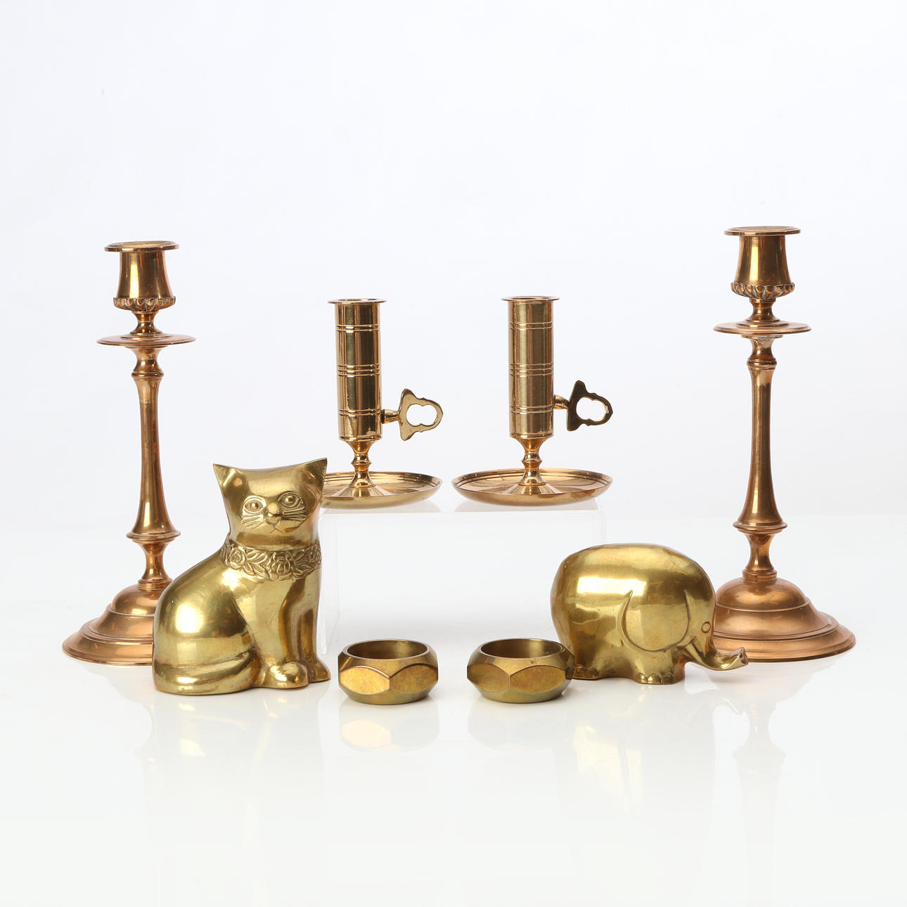 BRASS, EIGHT PIECES. Candlesticks etc. 20th century.