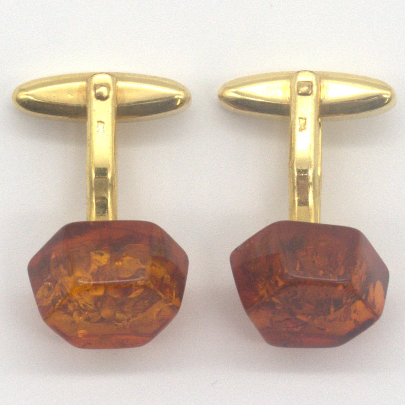 AMBER CUFFLINKS IN GOLD-FILLED SETTING, 20TH CENTURY.