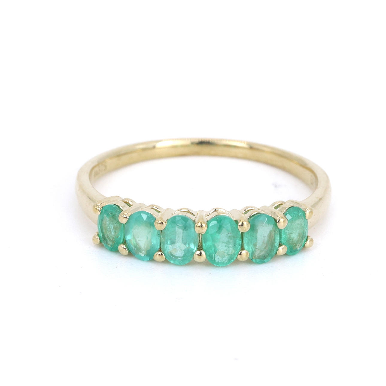 EMERALD 9CT HALF ETERNITY RING.