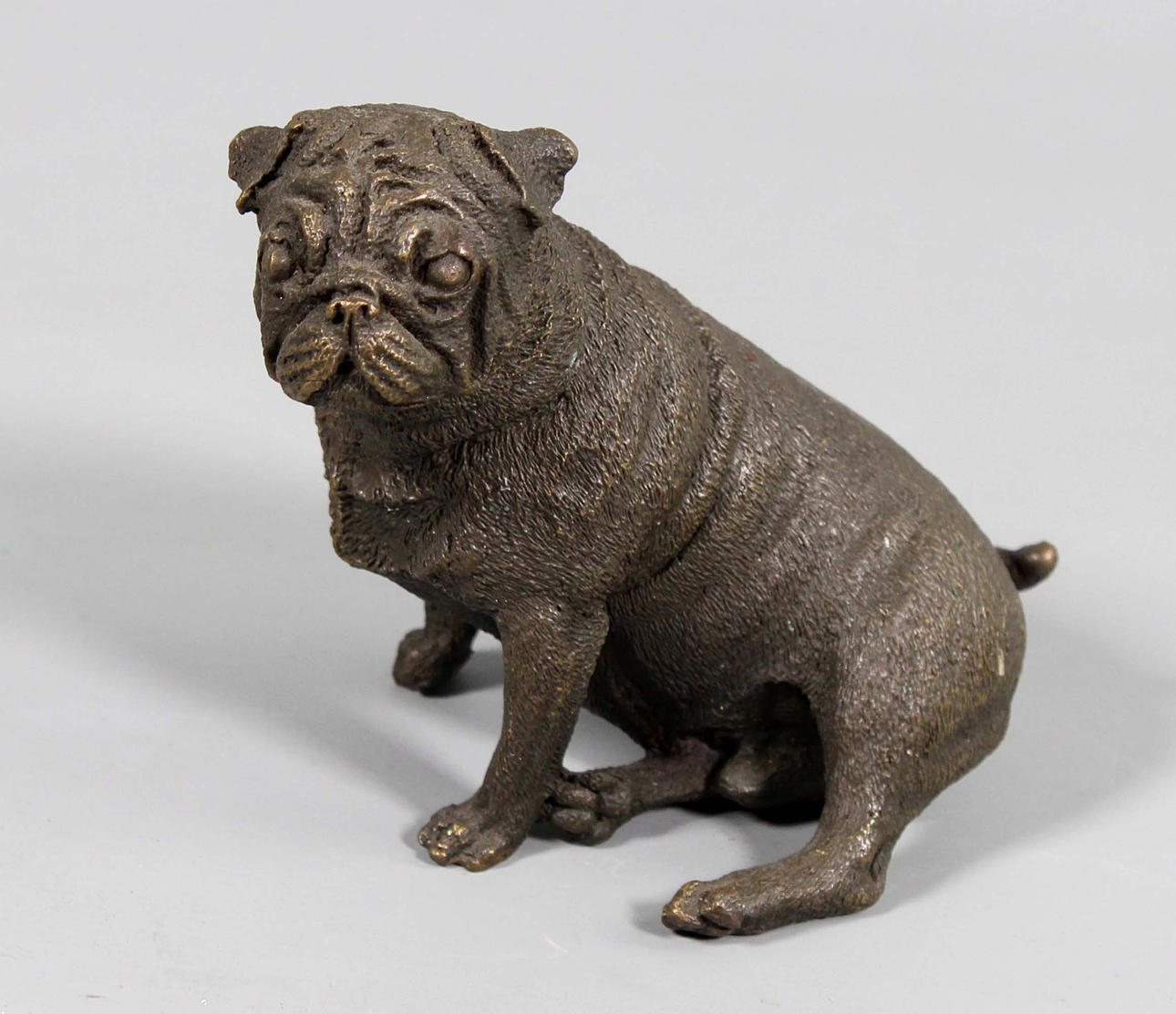 BRONZE DOG SCULPTURE.