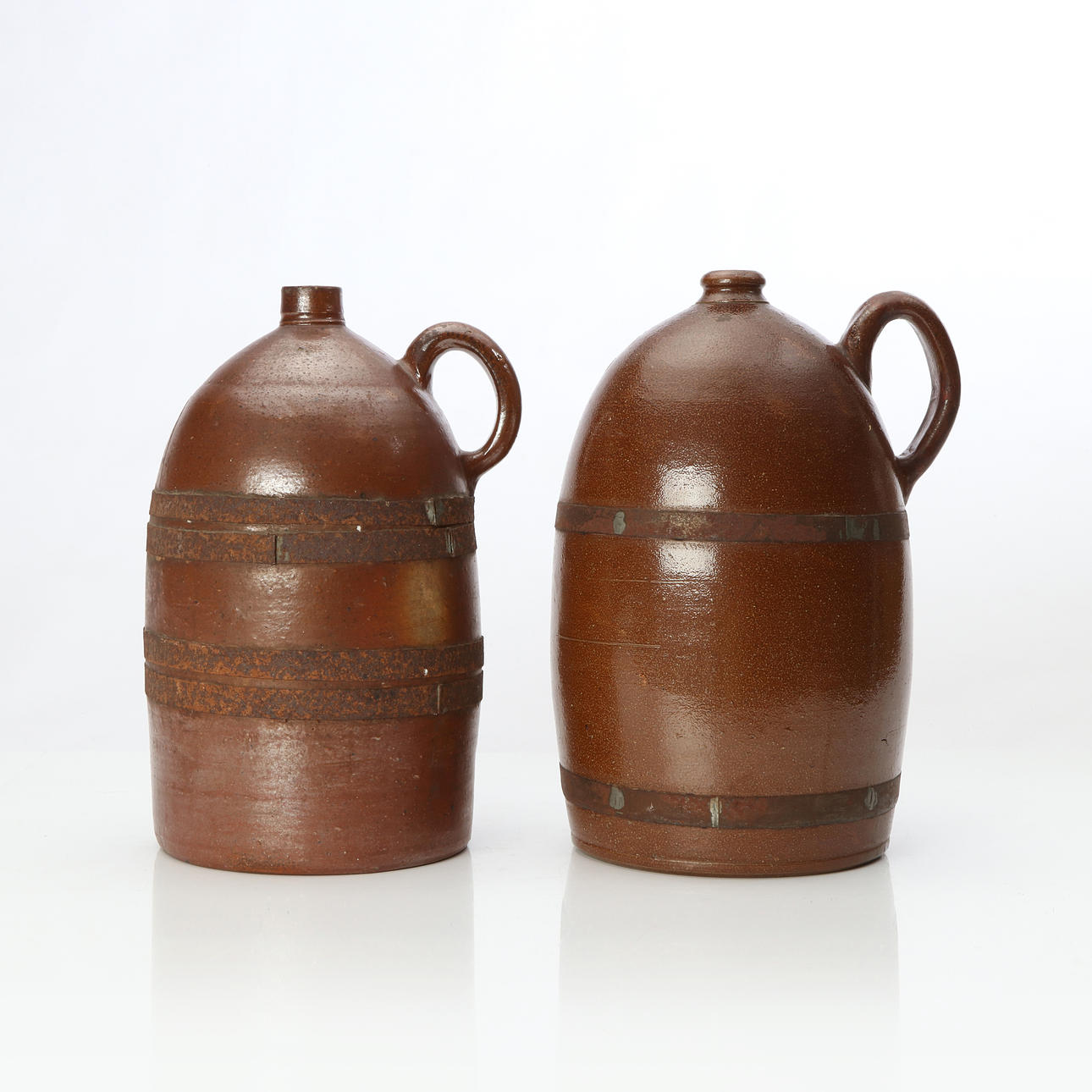 HELSINGBORG, JUGS, TWO. Glazed ceramic. With older repairs.