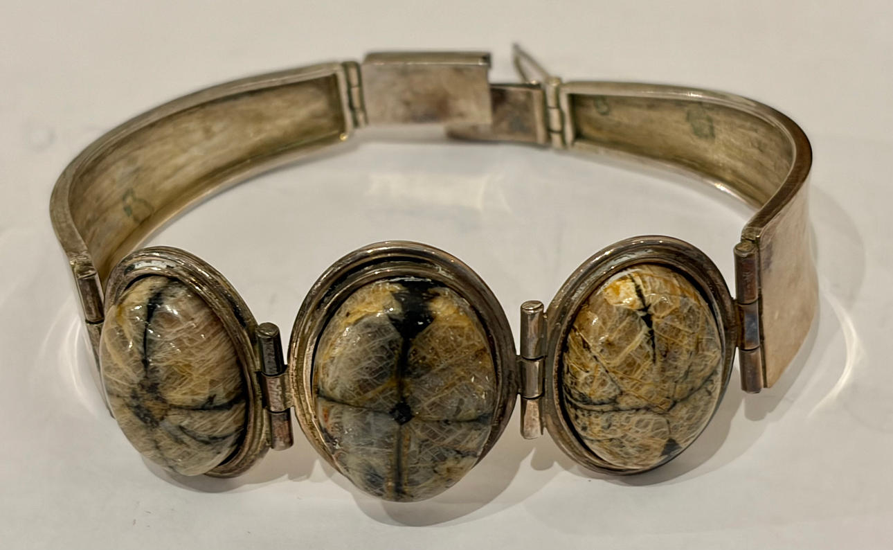 Silver and chiastolite bracelet, circa 1960.