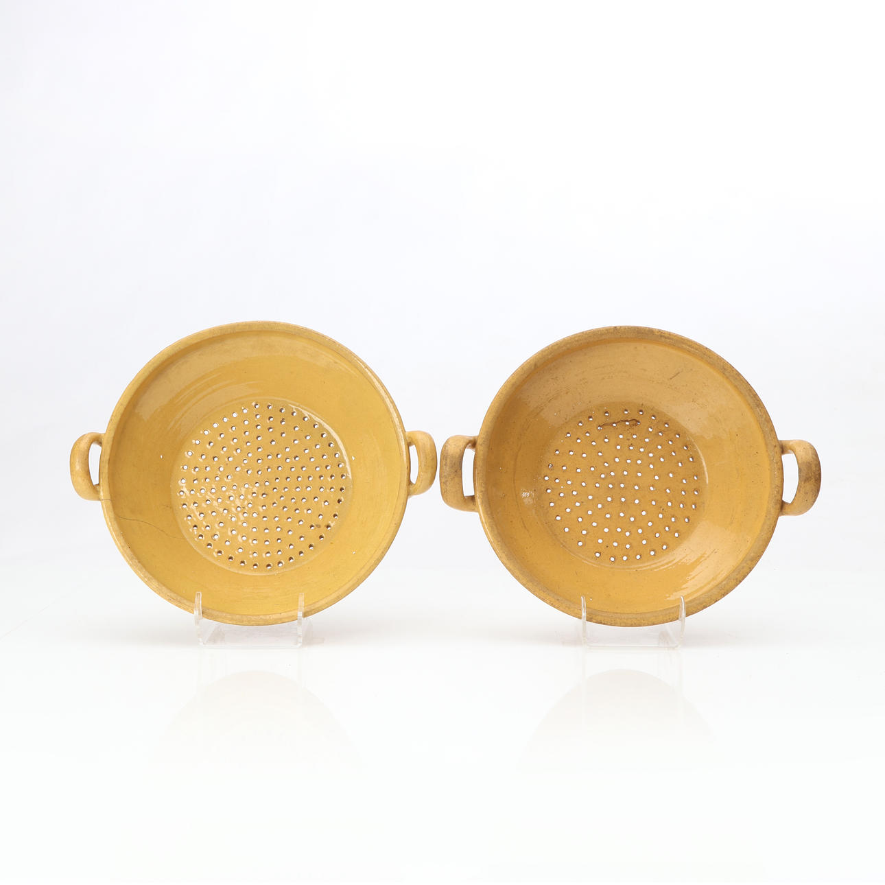 HÖGANÄS, STRAINERS, TWO. Glazed ceramic, 19th/20th century.